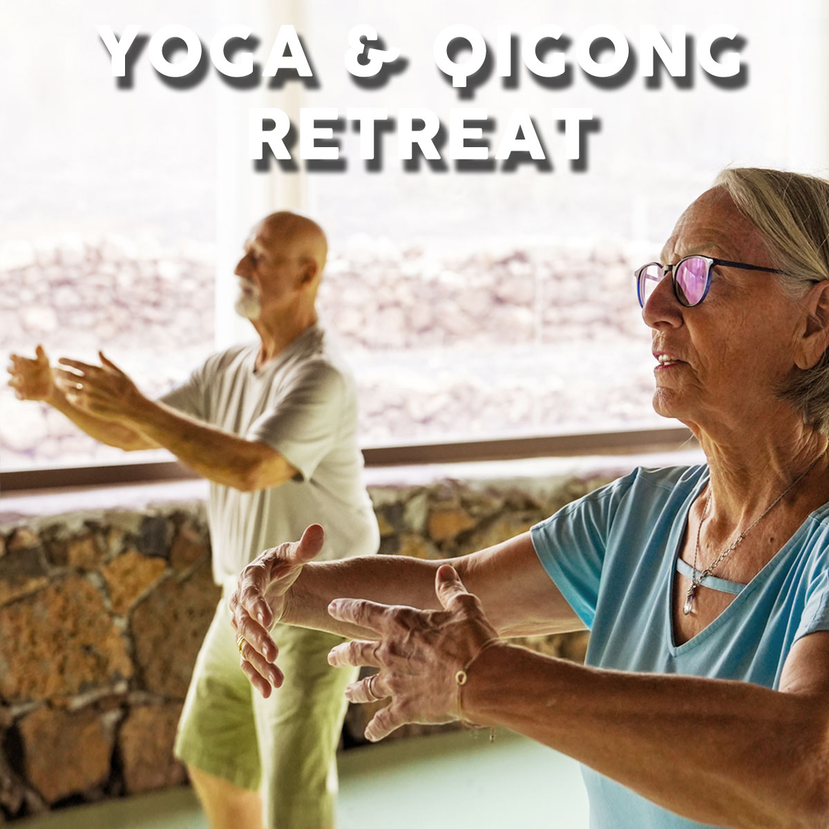 yoga-qigong-retreat-fuerteventura Older man and woman practicing standing Qigong meditation in the yoga shala at Villa Azul